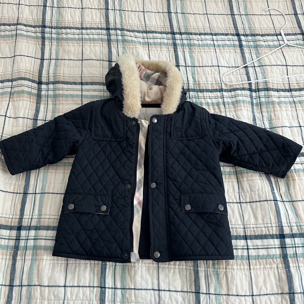 Burberry navy blue warm quilted jacket with hood. Size 12 months.